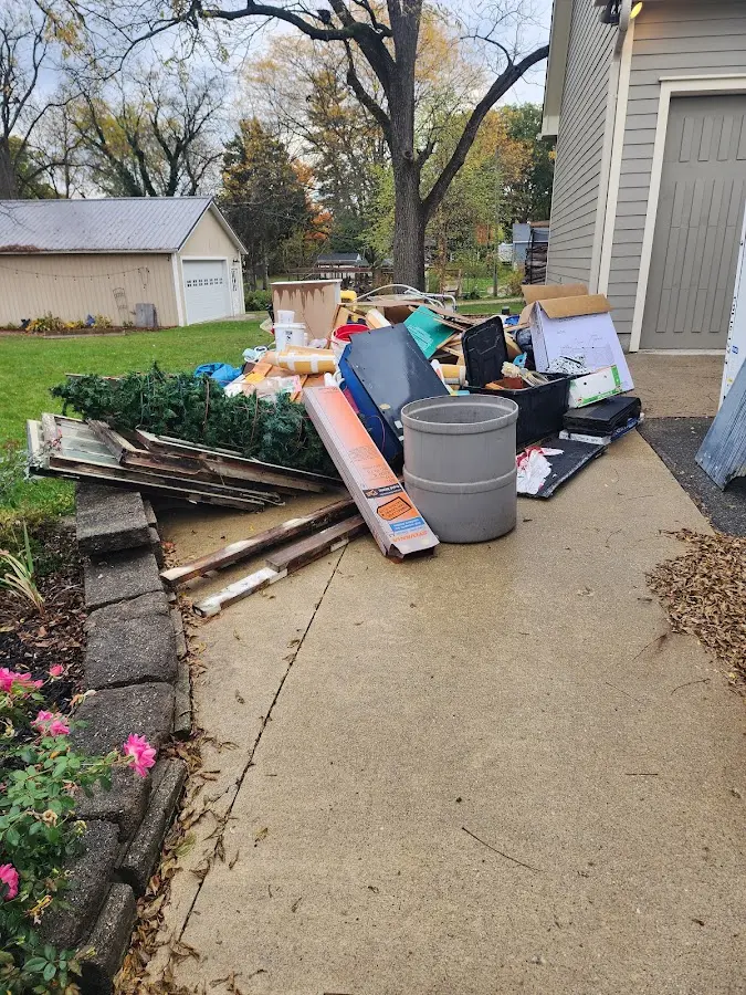Dumpster being loaded with debris for Residential Dumpster Rental in Villa Rica